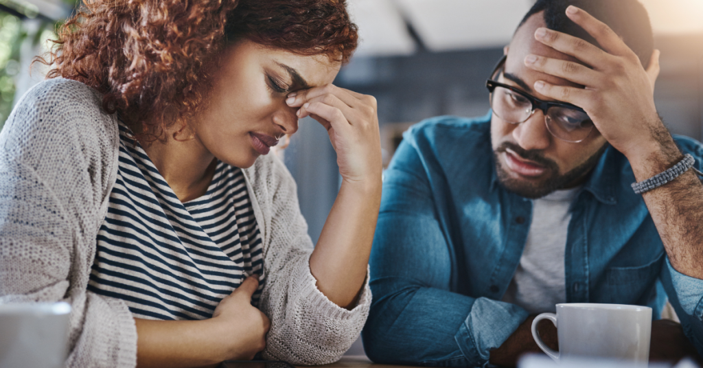 couple frustrated talking with personal injury lawyer about wrongful death lawsuit