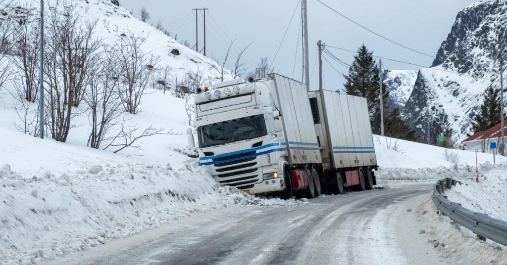 truck accident side of road in the snow