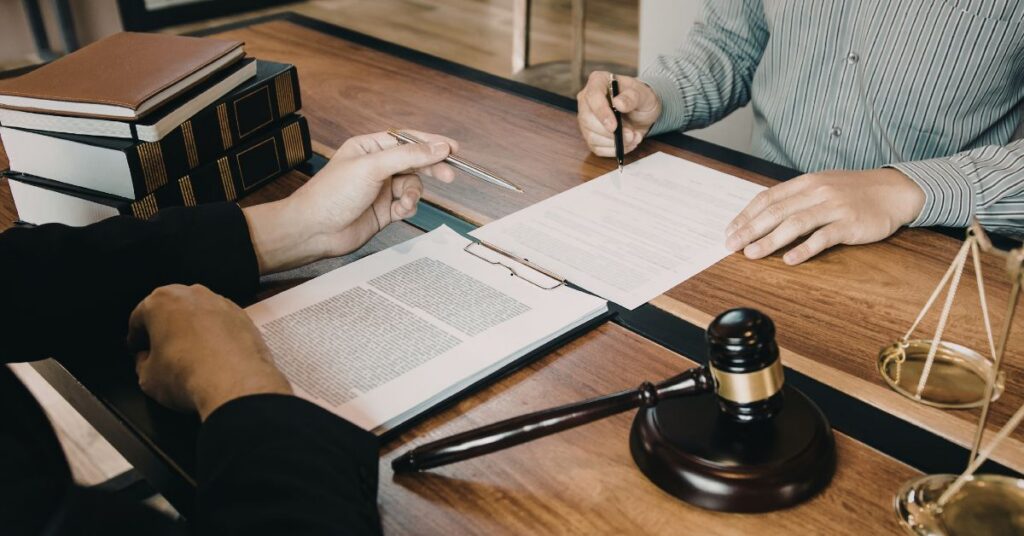 personal injury lawyer going over insurance claim