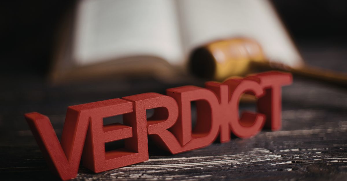 verdict sign in front of gavel and legislation