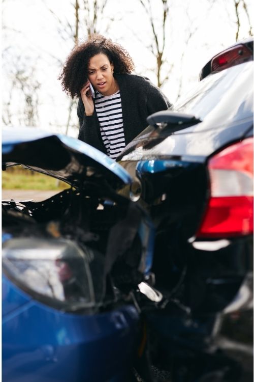 woman on phone after car accident